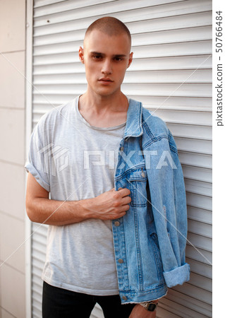 Handsome young American model man in jeans clothes 50766484