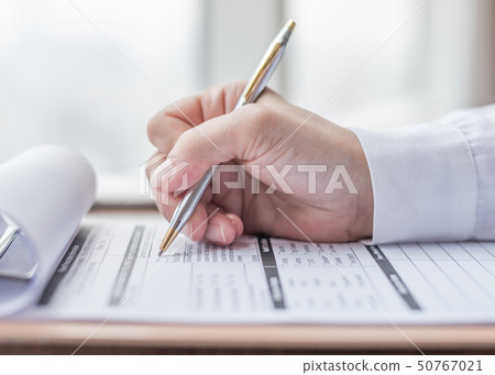 Applicant filling in company application form job Applicant filling in company application form job 50767021