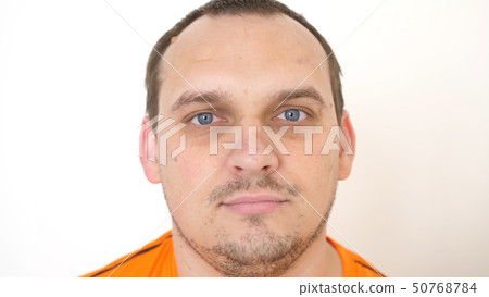 Face of young attractive bearded man with blue eyes on a white background 50768784