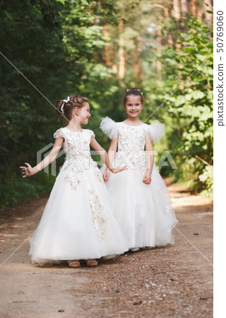 happy beautiful girls with white wedding dresses happy beautiful girls with white wedding dresses 50769060