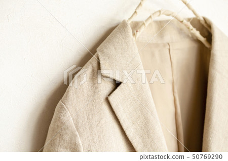 Close-up of beige jacket shoulders and collar on white background 50769290