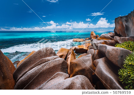 Beautifully shaped granite boulders on Grand Anse beach, La Digue island, Seychelles Beautifully shaped granite boulders on Grand Anse beach, La Digue island, Seychelles 50769559