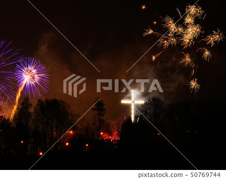 Colorful fireworks at holiday night 50769744