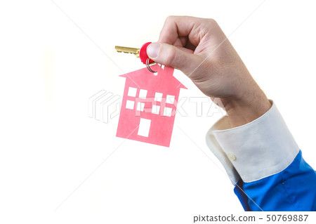 Man hand holding home keys Man hand holding home keys 50769887