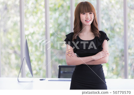Young lady in black dress Young lady in black dress 50770570