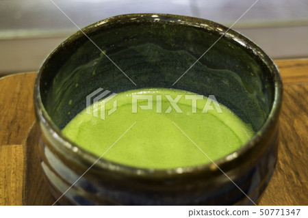 Bowl of hot matcha green tea drink 50771347