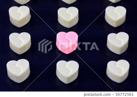 white heart chocolate in box hold by woman 50772561