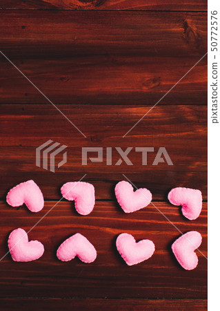 Valentine love heart confetti frame on wooden Valentine love heart confetti frame on wooden 50772576