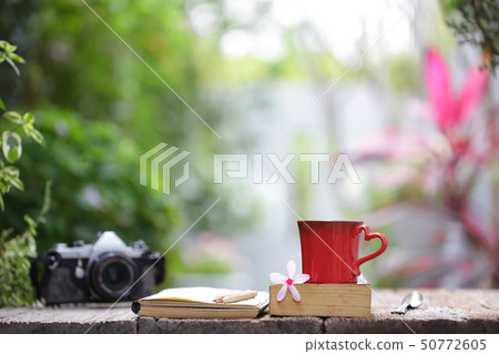 Red cup and notebooks at outdoor Red cup and notebooks at outdoor 50772605