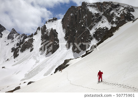 Mountains with avalanche traces, sunlit cloudy 50775901
