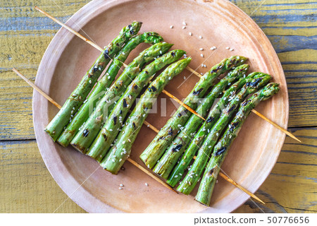 Grilled asparagus rafts with sesame seeds Grilled asparagus rafts with sesame seeds 50776656