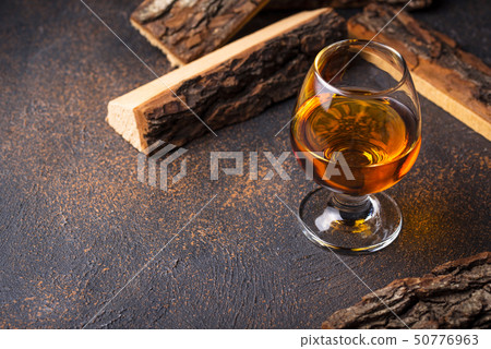 Glass of cognac or whiskey. 50776963