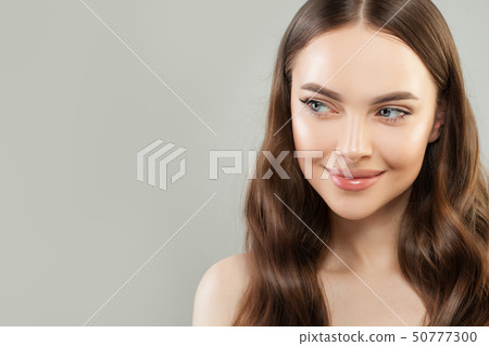 Portrait of cheerful woman with clear skin  50777300
