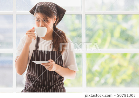 Asian woman at kitchen room 50781305