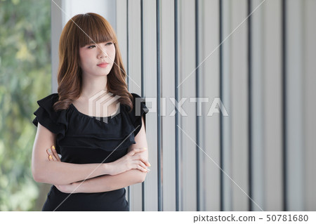 Young lady in black dress 50781680