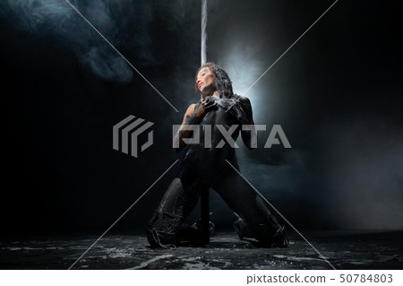 Young sexy dirty woman dancing striptease with pylon 50784803