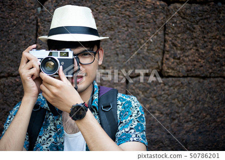 Young Man Photographer Traveler with backpack 50786201