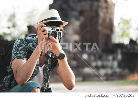 Young Man Photographer Traveler with backpack 50786202