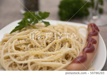 Serving of spaghetti with sausage. Serving of spaghetti with sausage. 50786283
