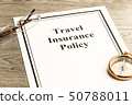 Travel Insurance Policy on Table. Business Concept 50788011