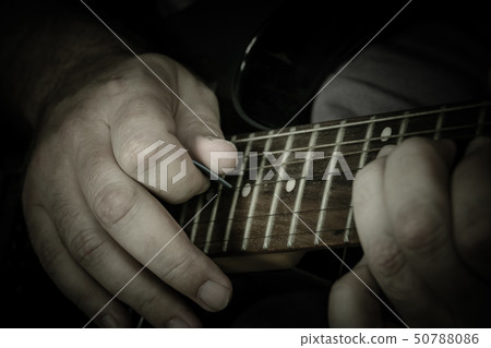 Close-up of man playing lead guitar solo 50788086