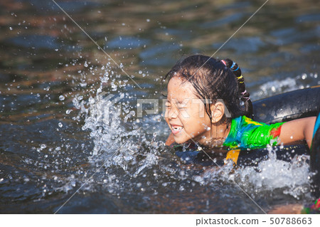 Cute asian child girls playing water Cute asian child girls playing water 50788663
