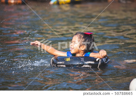 Cute asian child girls playing water Cute asian child girls playing water 50788665