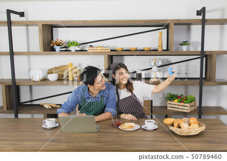 Asian couple at kitchen room Asian couple at kitchen room 50789460