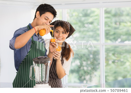 Asian couple at kitchen room Asian couple at kitchen room 50789461