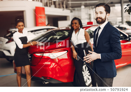 Two stylish black woman in a car salon Two stylish black woman in a car salon 50791924
