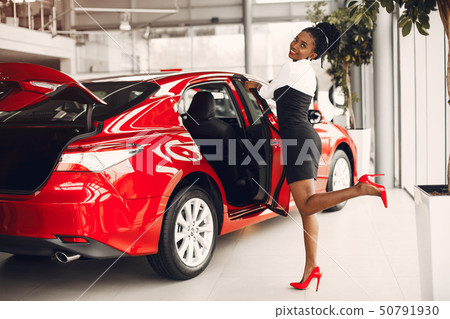 Stylish black woman in a car salon Stylish black woman in a car salon 50791930