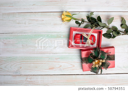 valentine love heart gift red toy car rose on wood 50794351