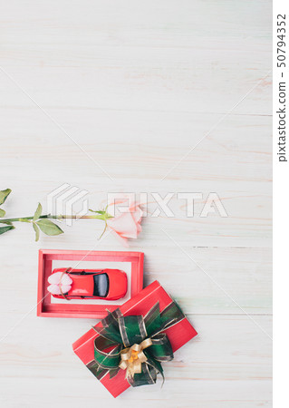 valentine love heart gift red toy car rose on wood 50794352
