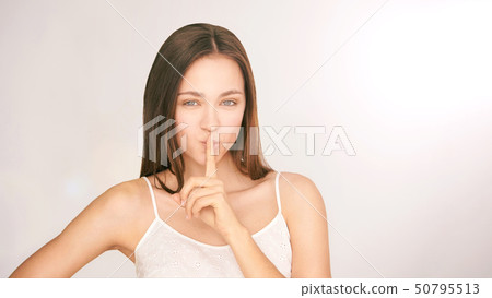 Beauty girl shh finger face. Silence secrect 50795513