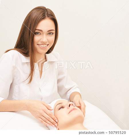 Face professional massage. Spa skincare treatment. Face professional massage. Spa skincare treatment. 50795520