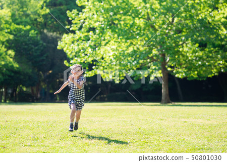 Girls running on the lawn Girls running on the lawn 50801030