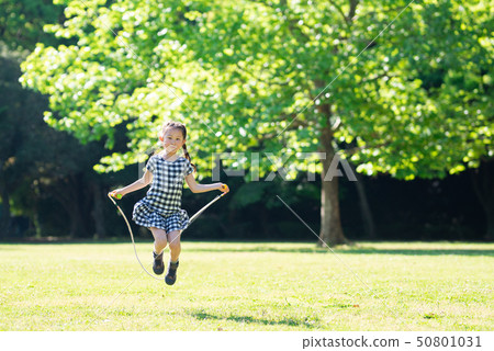 Girls playing with jump rope Girls playing with jump rope 50801031