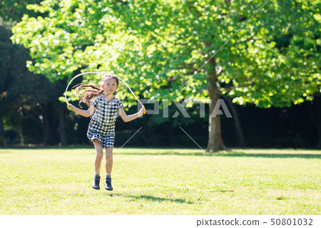 Girls playing with jump rope Girls playing with jump rope 50801032