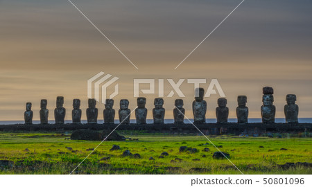 Sunrise clouds behind Moai statues of Ahu Tongariki on Easter Island 50801096