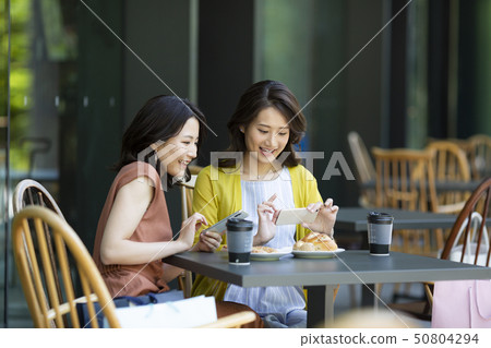 Young woman cafe 50804294