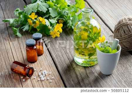 Bottles of homeopathic globules and infusion 50805112