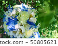 beautiful modern wedding bouquet on white table 50805621