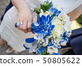 beautiful modern wedding bouquet on white table 50805622