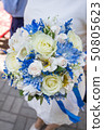beautiful modern wedding bouquet on white table 50805623