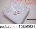 beautiful modern wedding bouquet on white table 50805624