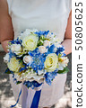 beautiful modern wedding bouquet on white table 50805625