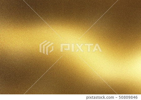 Glowing rough golden metal wall surface, abstract 50809846
