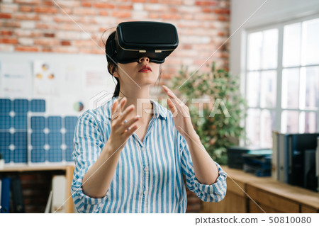 asian woman architect in vr headset at workplace asian woman architect in vr headset at workplace 50810080