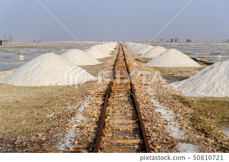 Heaps of salt along old narrow gauge railway Heaps of salt along old narrow gauge railway 50810721