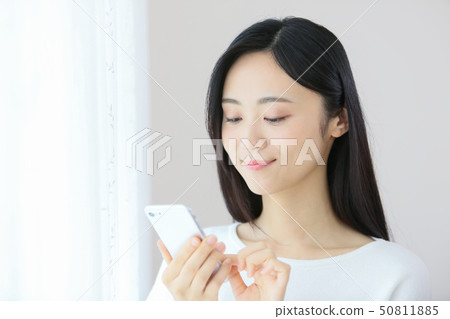 A young lady (a smartphone) 50811885